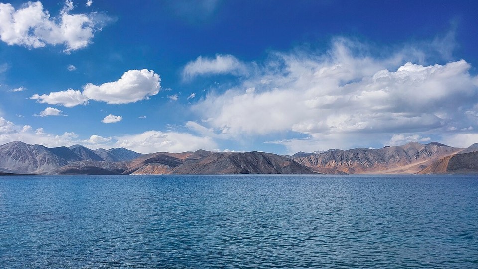 Pangong Lake under a blue sky in Ladakh
